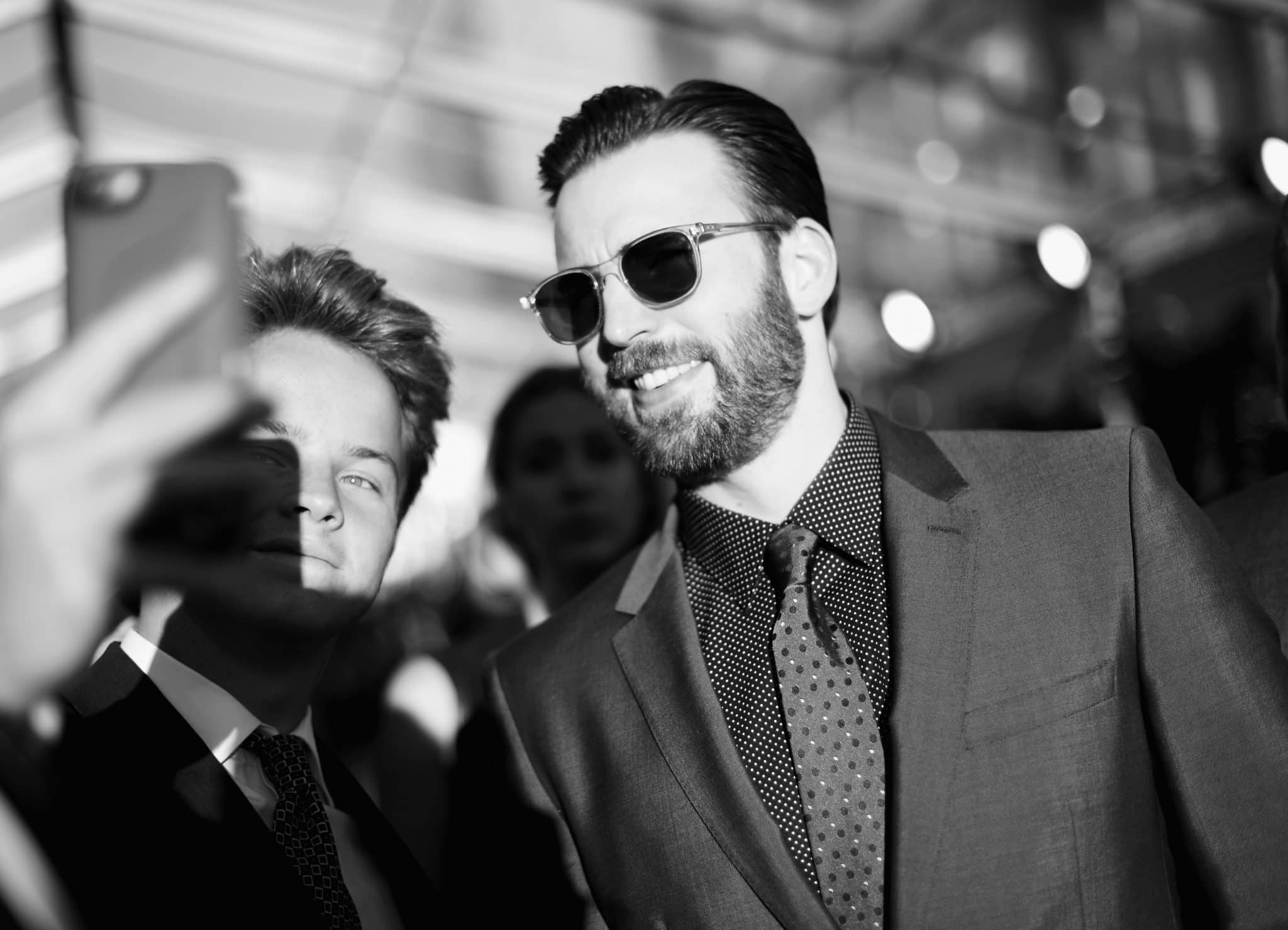 HOLLYWOOD, CALIFORNIA - APRIL 12: (EDITORS NOTE: Image has been shot in black and white..Color version not available.) Actor Chris Evans takes a selfie at The World Premiere of Marvel's "Captain America: Civil War" at Dolby Theatre on April 12, 2016 in Los Angeles, California. (Photo by Charley Gallay/Getty Images for Disney) *** Local Caption *** Chris Evans
