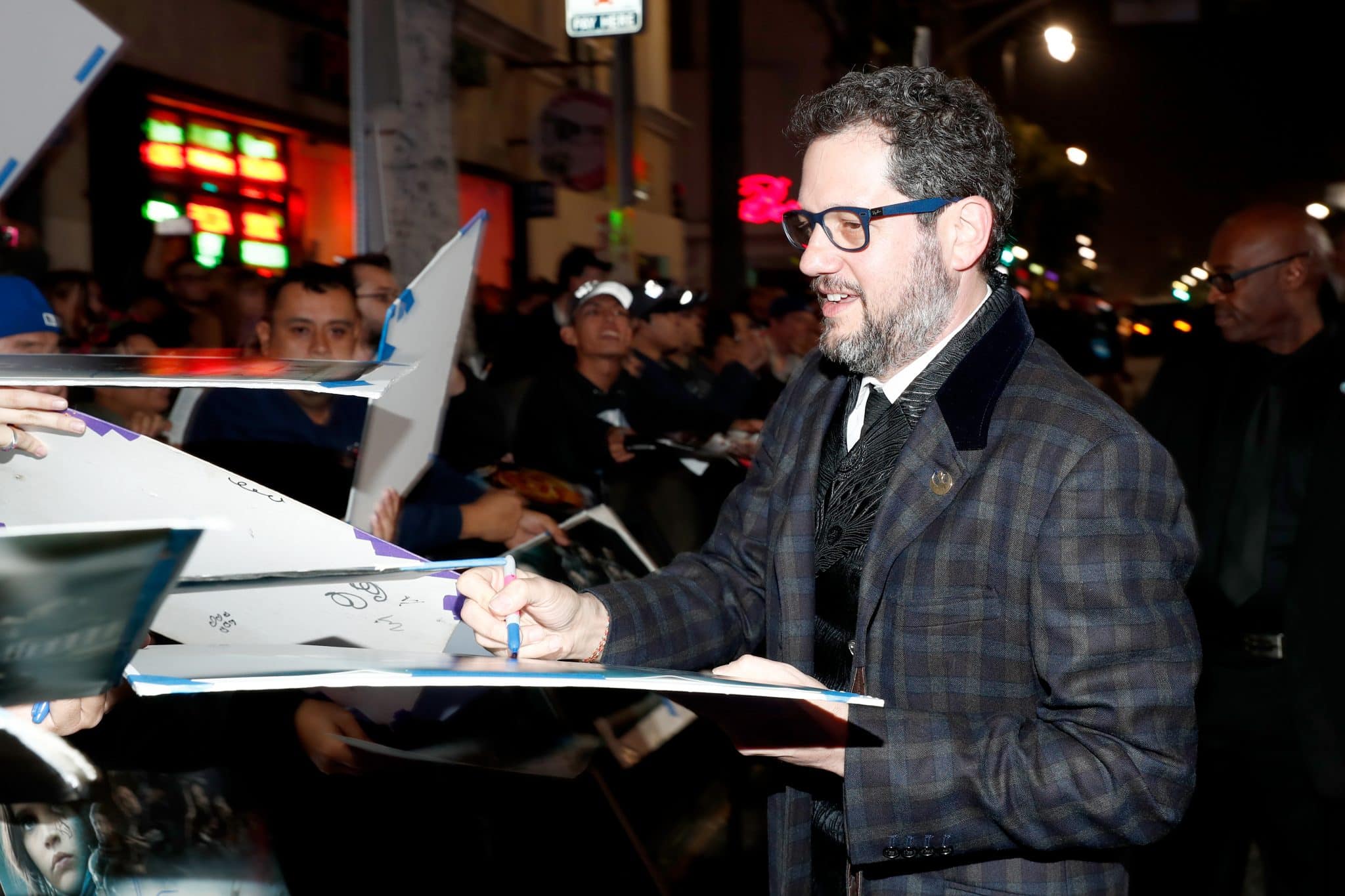 HOLLYWOOD, CA - DECEMBER 10:  Composer Michael Giacchino (R) signs autographs at The World Premiere of Lucasfilm's highly anticipated, first-ever, standalone Star Wars adventure, "Rogue One: A Star Wars Story" at the Pantages Theatre on December 10, 2016 in Hollywood, California.  (Photo by Rich Polk/Getty Images for Disney) *** Local Caption *** Michael Giacchino