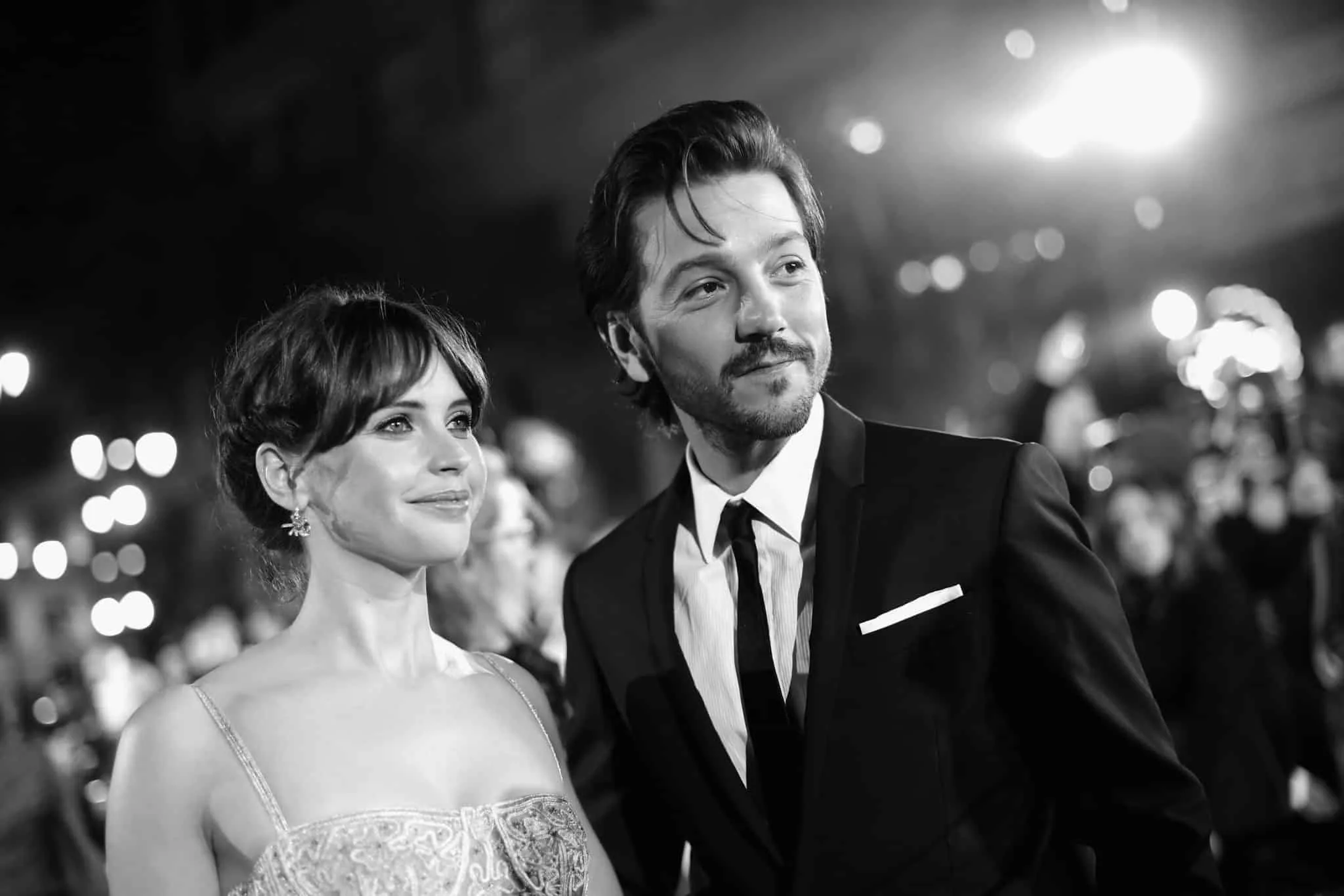 HOLLYWOOD, CA - DECEMBER 10:  (EDITORS NOTE: Image has been shot in black and white. Color version not available.)  Actors Felicity Jones (L) and Diego Luna attend The World Premiere of Lucasfilm's highly anticipated, first-ever, standalone Star Wars adventure, "Rogue One: A Star Wars Story" at the Pantages Theatre on December 10, 2016 in Hollywood, California.  (Photo by Charley Gallay/Getty Images for Disney) *** Local Caption *** Diego Luna; Felicity Jones